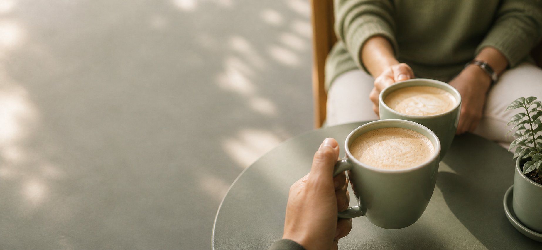 Two cups of coffee on a cafe table