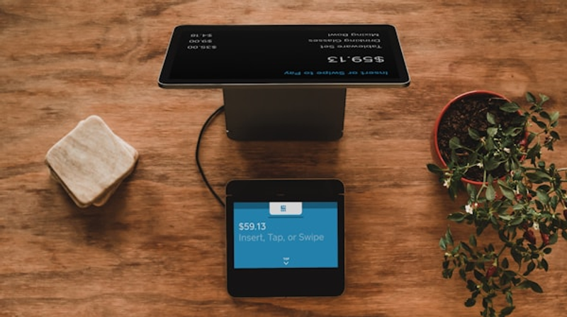 Customer scanning QR code with smartphone for digital loyalty rewards